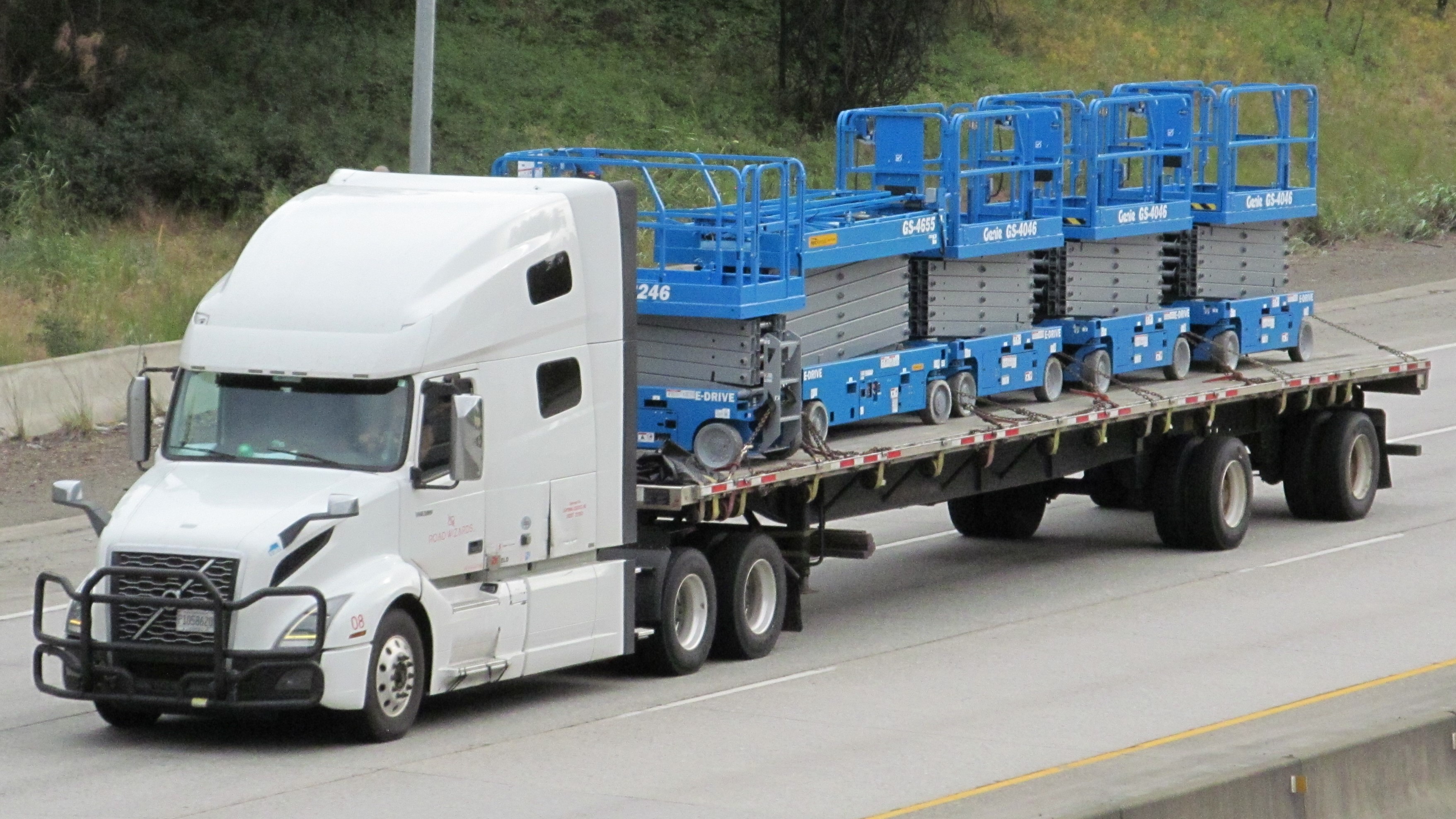 Flatbed truck carrying industrial equipment