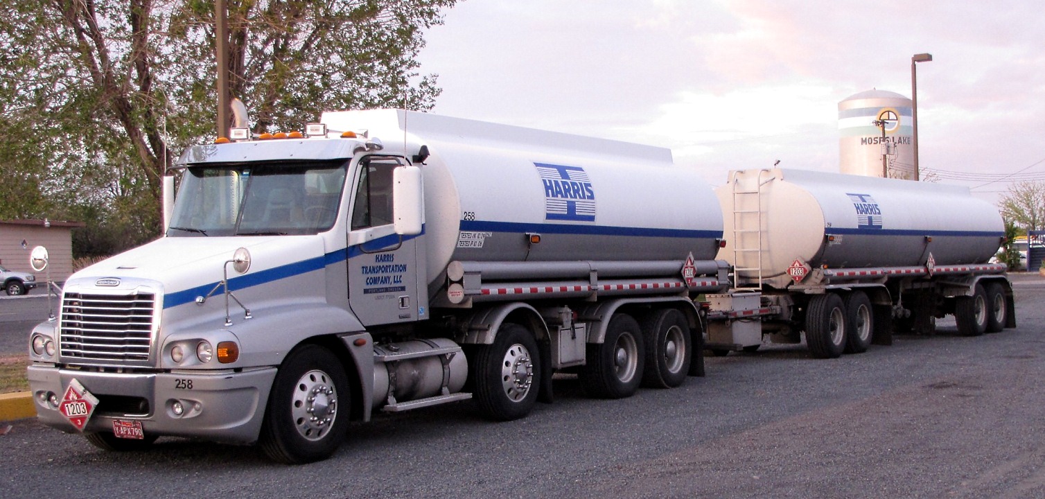 Freightliner hauling twin liquid tank trailers.